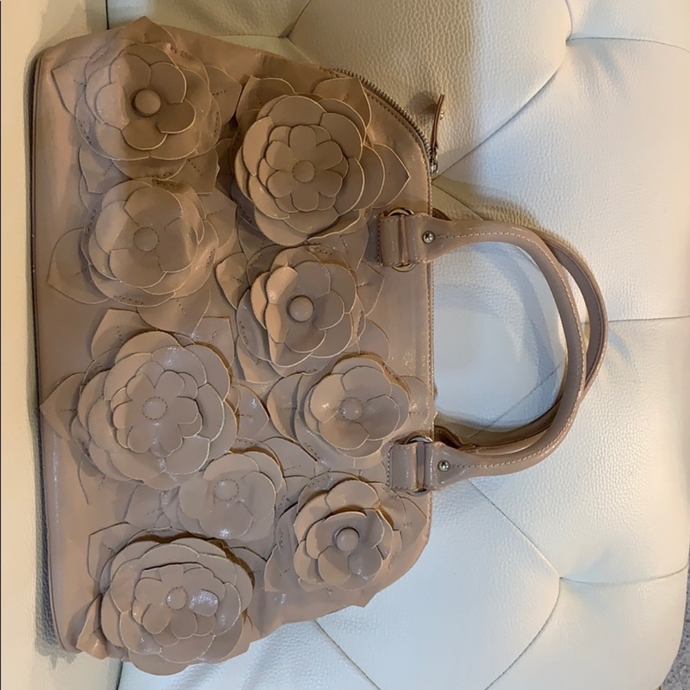 Steve Madden bag with 3-D flowers.